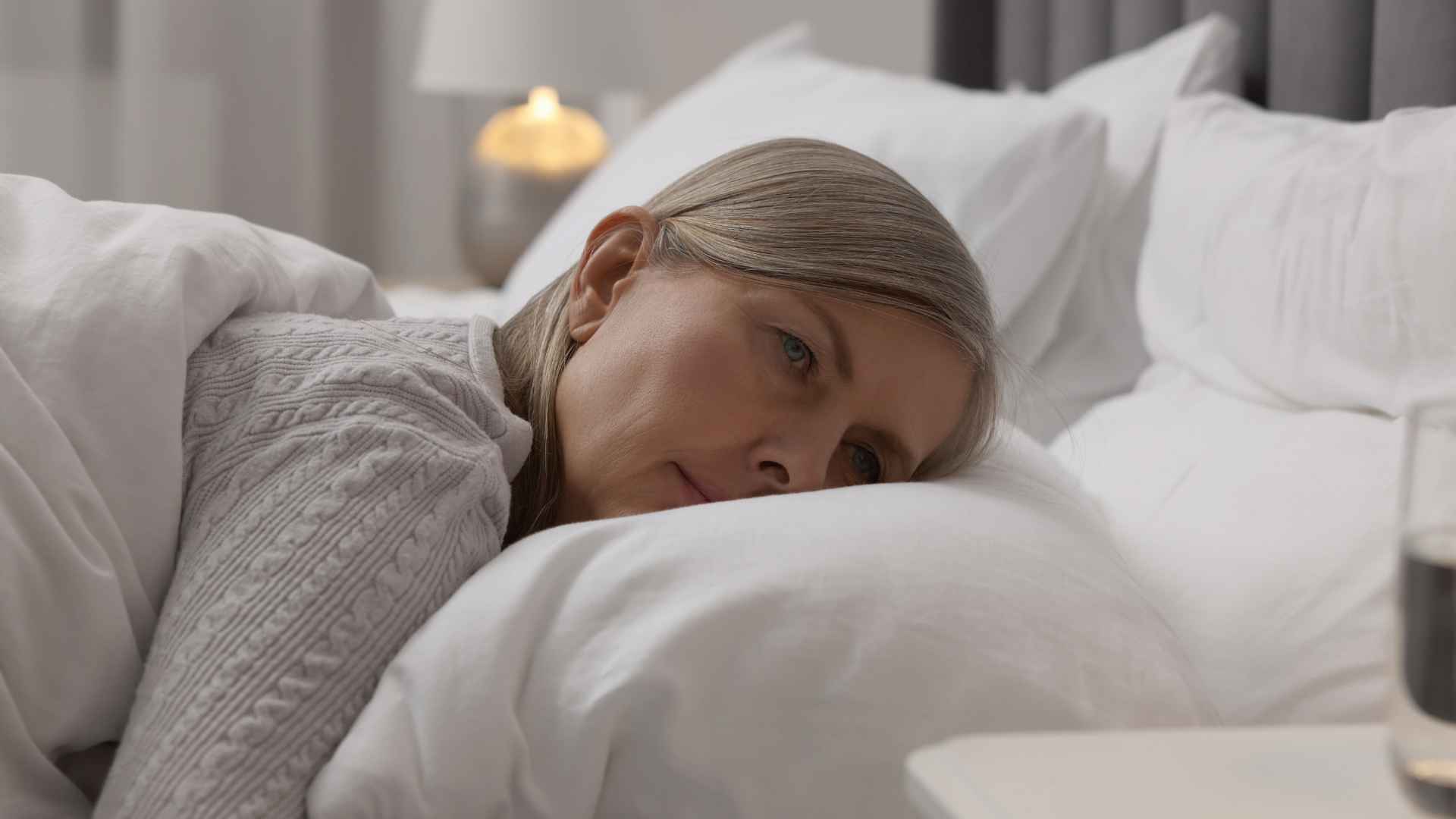a woman lying in a bed