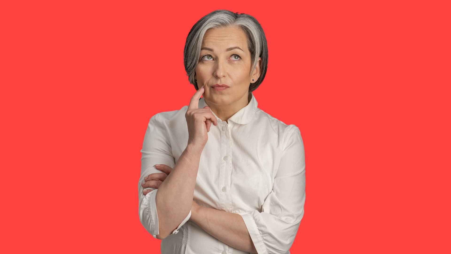 a woman with grey hair and white shirt