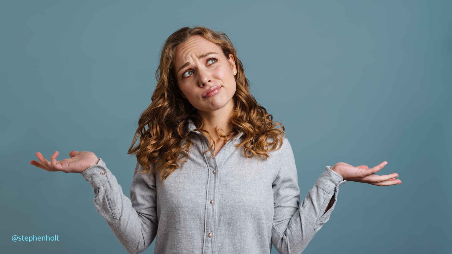 a woman with her hands out and her eyes closed